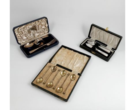 A cased silver three piece christening set, comprising fork, spoon and napkin ring, Sheffield 1936/7, maker Mappin and Webb, 