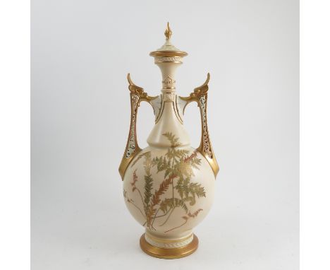 A Royal Worcester vase, with associated cover, in the Persian style, decorated with shot silk ferns to a gilt ivory ground, w