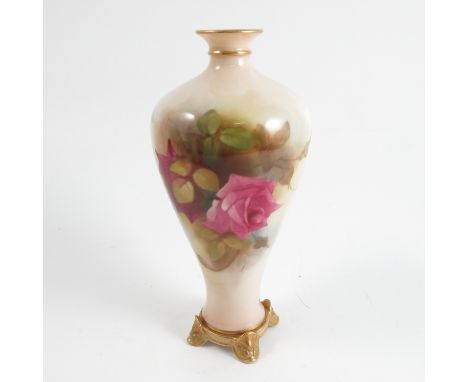 A Royal Worcester vase, decorated with roses, shape number H106, 1918, having four dolphin feet, height 6.5ins Condition repo