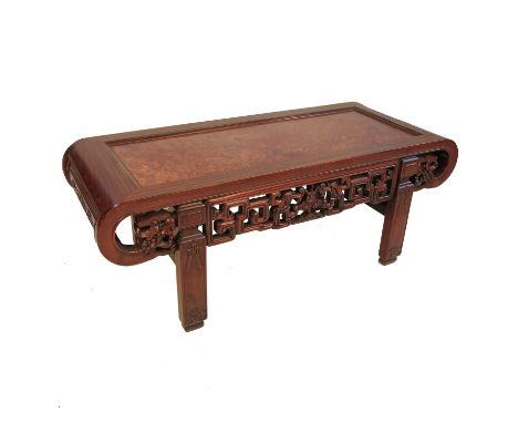 A Chinese hardwood opium table, with pierced frieze and scroll end, width 38ins Condition report: Various scuff marks and dam