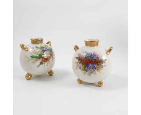 A pair of Royal Worcester spherical vases, decorated with flowers, having three balled feet, height 4ins Condition report: On