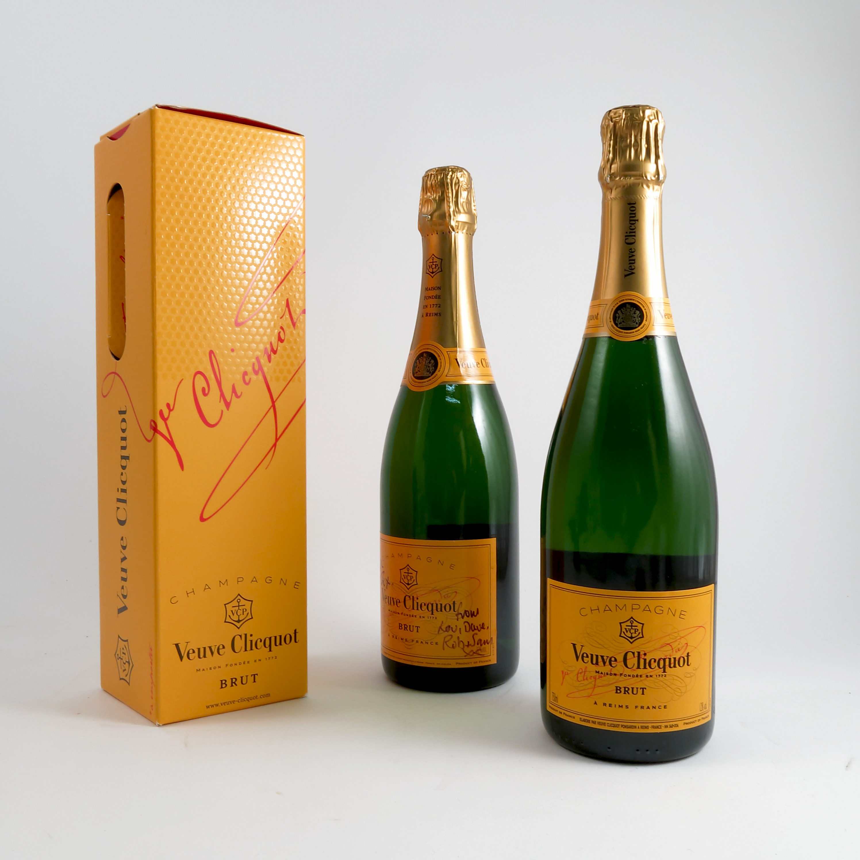 A boxed bottle of Veuve Clicquot, together with two other bottles of ...