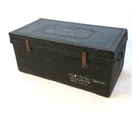 A studded ships trunk, with brass plaque bearing name G.R.French, with stencilled label S.S Queen Elizabeth, New York and a C