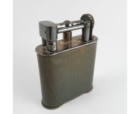 A Wilson & Gill silver plated table lighter, with green leather covered body, height 4.25ins