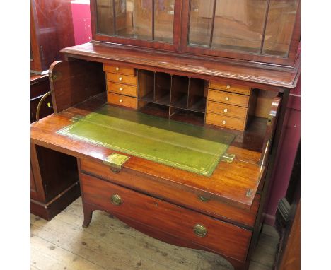 A 19th century mahogany secretaire bookcase, with astragal glazed upper section, fitted with a secretaire drawer to the base,