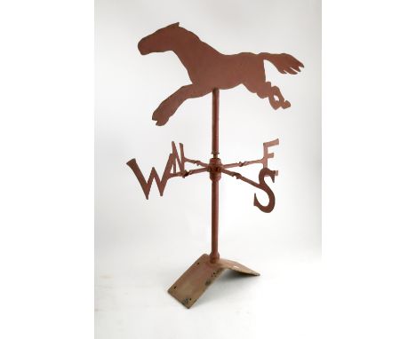 A 19th century Victorian wrought iron weather vane, of a galloping horse, complete with roof-top fitting bracket