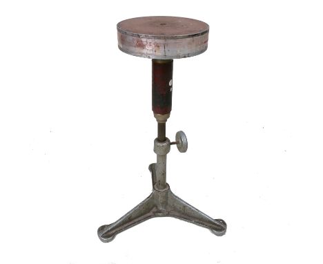 Four various porcelain turntables, raised on adjustable column supports with tripod bases, diameter approximately 10ins