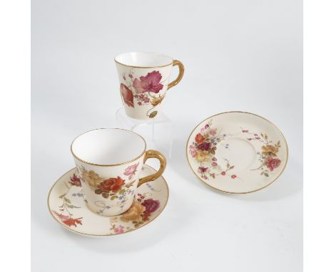 A Royal Worcester gilded ivory coffee cup and saucer, decorated with flowers and another Condition report: Condition commensu