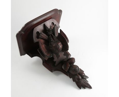 A Victorian carved mahogany wall bracket, formed as a shelf with  two hanging dead birds and fruit below, height 17ins, dimen
