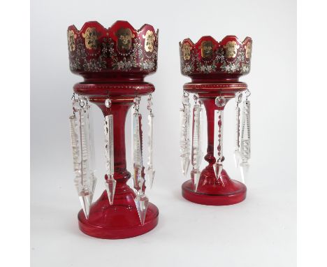 A pair of ruby glass lustres, with gold and jewelled decoration, height 14ins Condition report: Rubbing to gilded decoration,