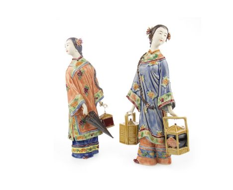 PAIR OF 20TH CENTURY FIGURES OF FEMALES, in glazed and unglazed ceramic, each female modelled standing, 29cm high, in Chinese