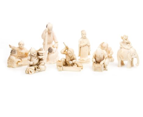 COLLECTION OF EIGHT LATE 19TH/EARLY 20TH CENTURY JAPANESE CARVINGS, including a group of a man and child, signed, 6cm high; a