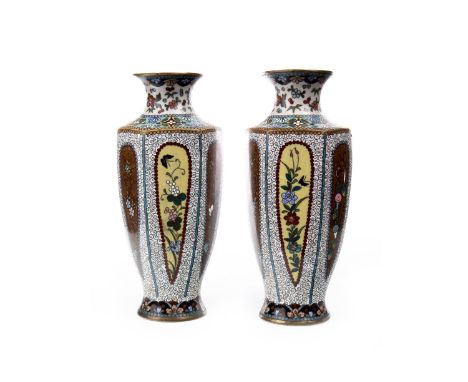 PAIR OF EARLY 20TH CENURY CHINESE ENAMEL VASES, of hexagonal baluster form, decorated with panels of flowers, 16.5cm high