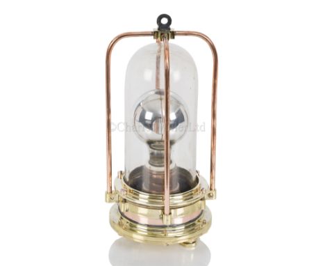 A RARE DIVING LAMP BY C.E. HEINKE &amp; CO., LONDON, CIRCA 1930 heavily constructed in brass with copper guards, thick domed 