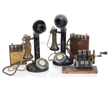 TELEPHONY comprising two candlestick telephones with dials, two receivers, a dynamo, assorted brass and Bakelite handsets and