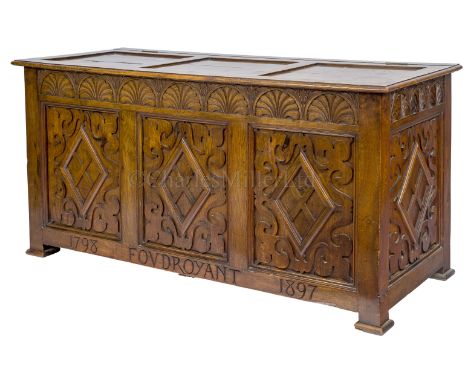 A LARGE CHEST MADE FROM FOUDROYANT OAK BY GOODALL, LAMB &amp; LEIGHWAY, CIRCA 1898 the sides carved with lozenges and fleur d