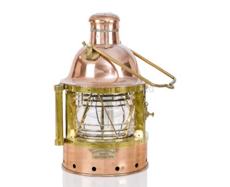 A RARE NAVIGATION LAMP BY CHANCE BROTHERS &amp; CO. LTD, CIRCA 1900 constructed in polished copper and brass, bell top with c