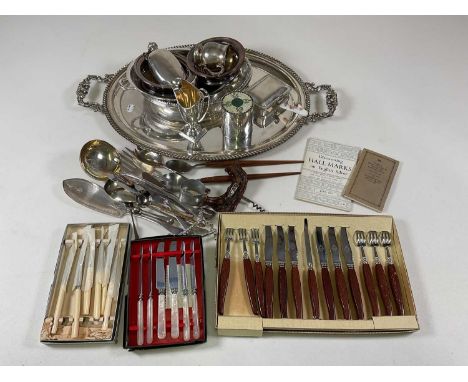A quantity of silver plate including a large twin handled tray, entrée dish, mug, bottle coasters, flatware, etc.