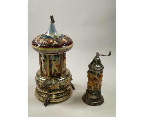 CAPODIMONTE; a large cherub embossed musical cigarette dispenser and a similar smaller musical grinder (2)