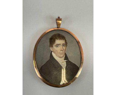 X An early 19th century English oval portrait miniature 'Archibald Morrison', unsigned, with rose gold coloured back bearing 