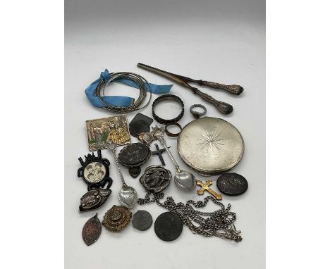 A small collection of costume jewellery including a plastic 'Beatles' brooch, white metal chains, also a group of bangles, co