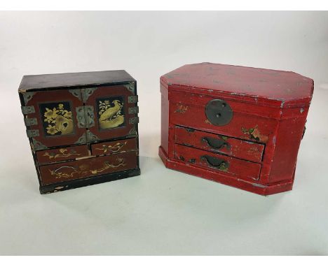 A Chinese lacquered table top cabinet with painted and gilt decoration of birds and flowers and white metal decorative mounts