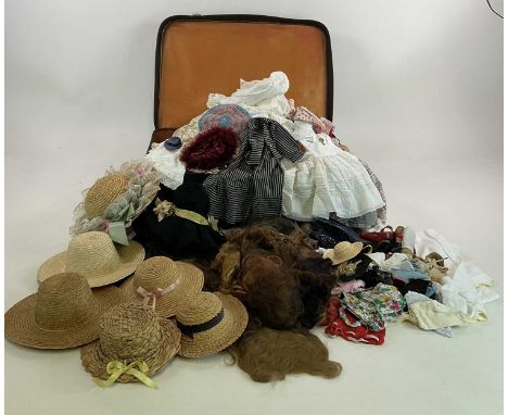 A large collection of vintage doll's accessories including clothes, shoes, boots wigs, hats and others