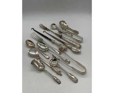 GEORGE UNITE; a late Victorian hallmarked silver caddy spoon, Birmingham 1898, a further silver caddy spoon, silver coffee sp