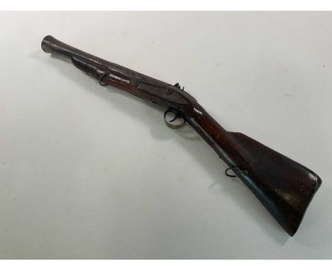 A 19th century blunderbuss with flintlock action, roller fisson and indistinct engraving to the lock plate, with part octagon