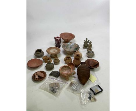 A collection of ancient pottery and artefacts, also some shards, including a pre-Columbian stemmed bowl purchased from the He