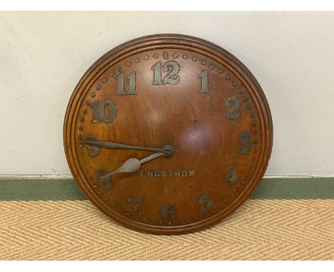ENGSTROM OF SWEDEN; an early 20th century wall clock, constructed of solid oak of convex form, with Zenith movement, diameter