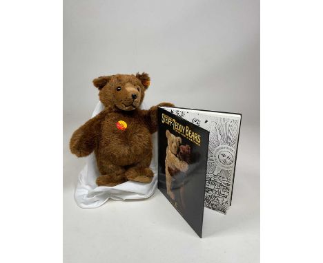 STEIFF; an Urs bear together with a 'Steiff - Teddy Bears Love for a Lifetime' book.