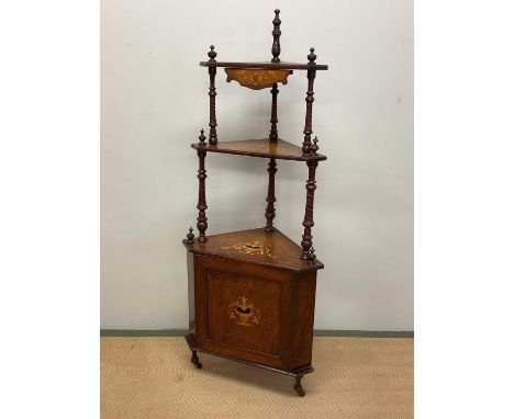 A late 19th century inlaid mahogany three shelf corner whatnot with base cupboard on turned supports and castors, height 149c