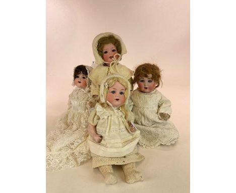 Four bisque vintage dolls comprising an Armand Marseille A3M 990 16" bent limb doll, a Armand Marseille 16" AM 990 bent limb 