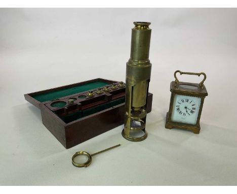 A mahogany cased brass Cuff type microscope, height of instrument 24.5cm, also a brass carriage clock (af) (2)