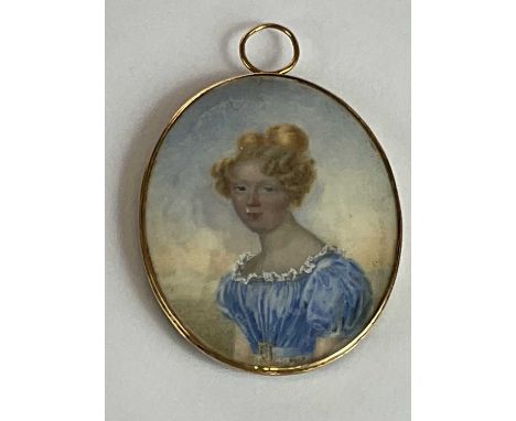 X A late 19th century oval portrait miniature, young woman wearing blue dress with plaited hair and yellow metal initials to 