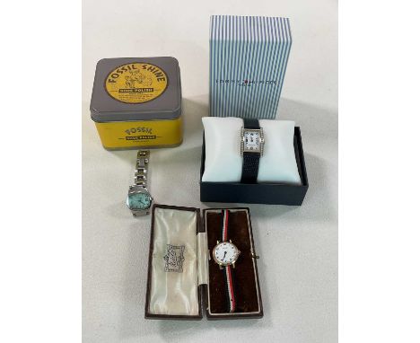 Three boxed wristwatches, comprising Fossil, Nivada, and Tommy Hilfiger (3)