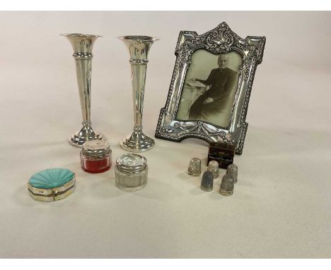 A group of small hallmarked silver items comprising photograph frame, pair of bud vases, an enamel decorated octagonal compac