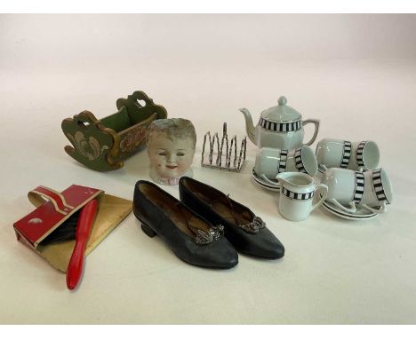 Collectors' items to include a vintage pair of child's shoes with kitten heels, length 16cm, a doll's teaset, a painted cradl