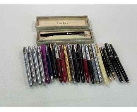 A collection of vintage pens, both fountain and ballpoint, including Parker, Waterman etc.