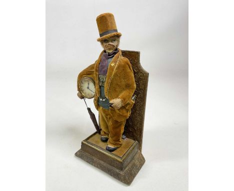 IN THE MANNER OF KARL GRIESBAUM; an early 20th century whistling automaton figural clock, a mustachioed man wearing exaggerat