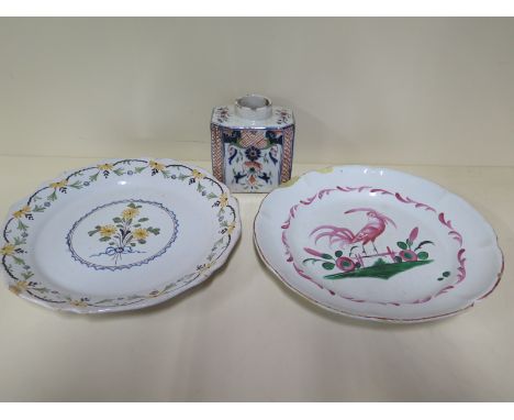 Two Delft plates, 23cm diameter and a tea caddy - 10cm tall, chips to all, cockerel plate and caddy have crazing, otherwise n