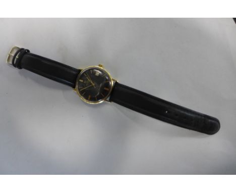 A gents Omega automatic Seamaster wristwatch with black dial and date aperture on black leather strap - 37mm wide including b