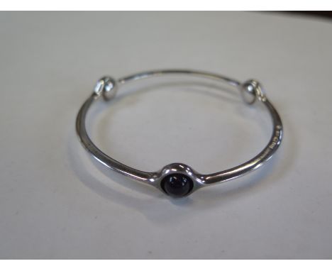 A Georg Jensen silver and amethyst bangle, no 473 - 6.5cm diameter, in good condition, minor marks 