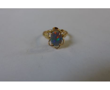 A 14ct opal set ring in ornate pierced mount , size K, approx 2.7 grams, in good condition 