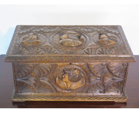 A 19th century French Bretton carved oak trinket box, 20cm tall x 40cm x 23cm  - in good polished condition 