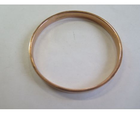 A 9ct gold bangle approx 11.9 gram,s approx 7.2cm - internal diameter -  overall in good condition but with some surface wear