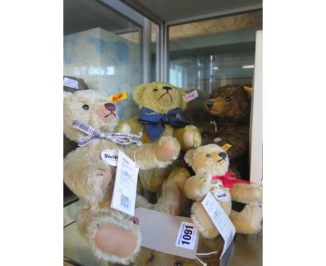 Four Steiff teddy bears - A Million hugs, brass coloured bear limited edition 2014 of 3000 - and two other others, all withou