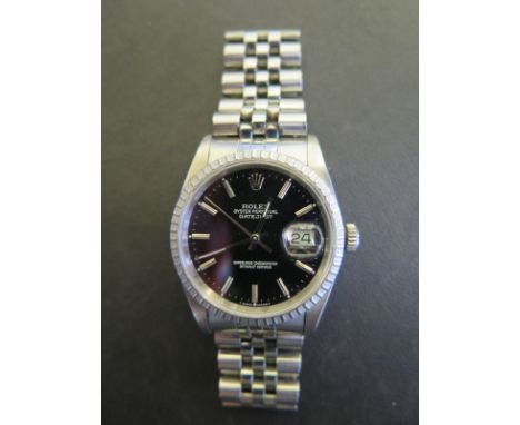 A 1990 gents stainless steel Rolex Oyster perpetual Datejust automatic calendar wristwatch with black dial on Rolex stainless
