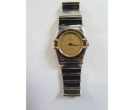 A ladies bi metal Omega constellation quartz wristwatch, 24mm wide including button - no 6148/436 - in good condition and wor